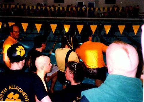 Ellen Paige, Evan Smith, Pam Murphy, Bill Smith at a swim meet.